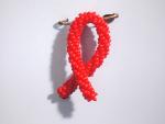 Červená stužka - symbol boje proti AIDS a solidarity s lidmi žijícími s HIV/AIDS 